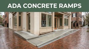 Concrete ADA ramp leading from a wet sidewalk to a Charleston storefront entrance.
