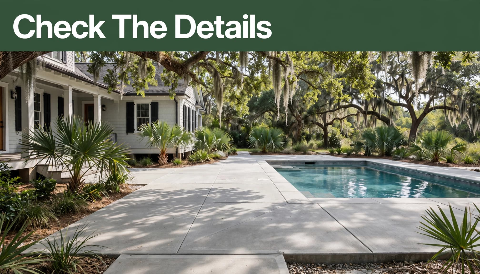 Finished concrete patio and pool deck beside a Lowcountry home with palmettos and oak shade.